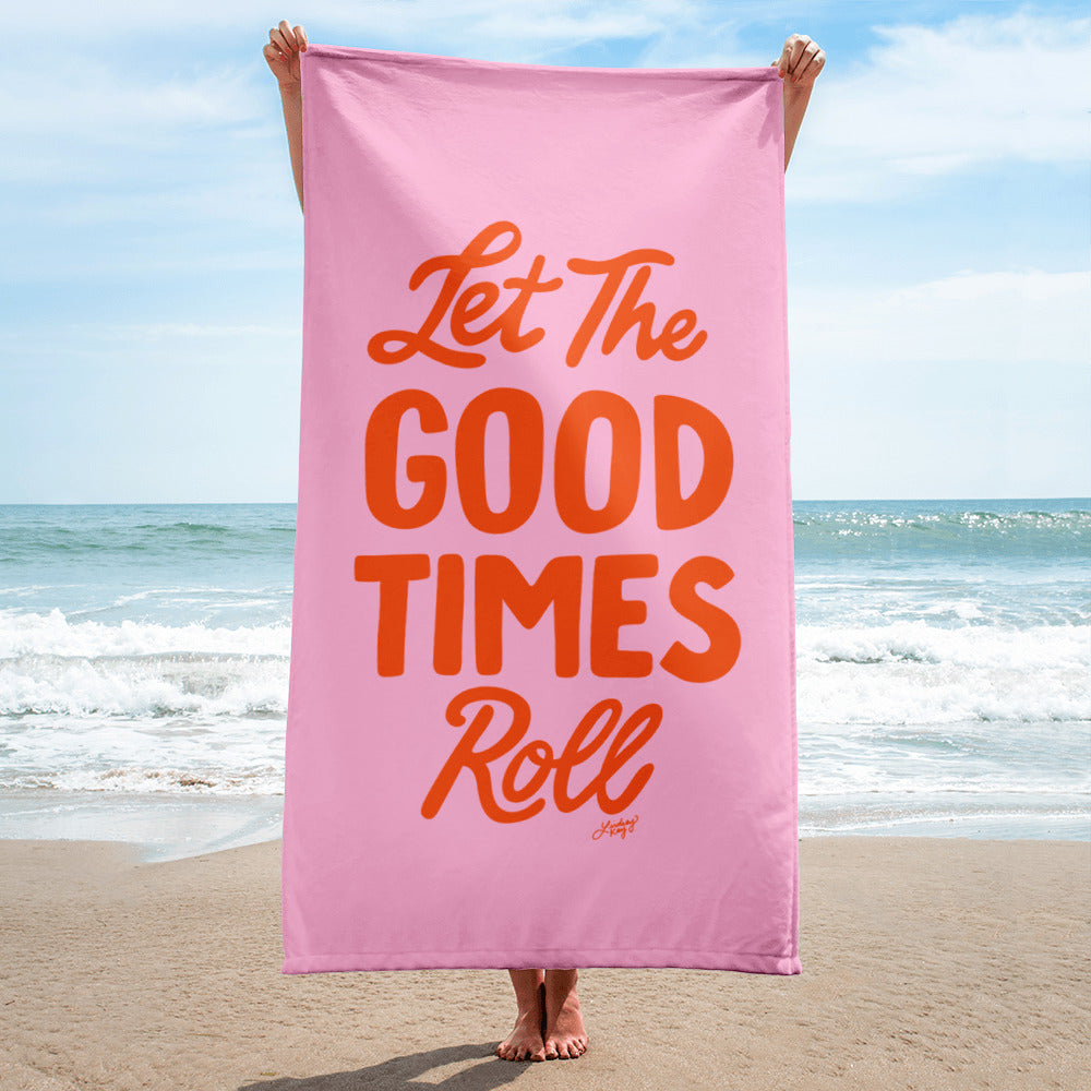 Pink and red beach towel with hand-lettered “Let the Good Times Roll” design by Lindsey Kay Collective. Retro girly summer towel for pool parties, beach vacations, bachelorette trips, and trendy gift ideas. 30x60 cotton polyester towel with bold typography.